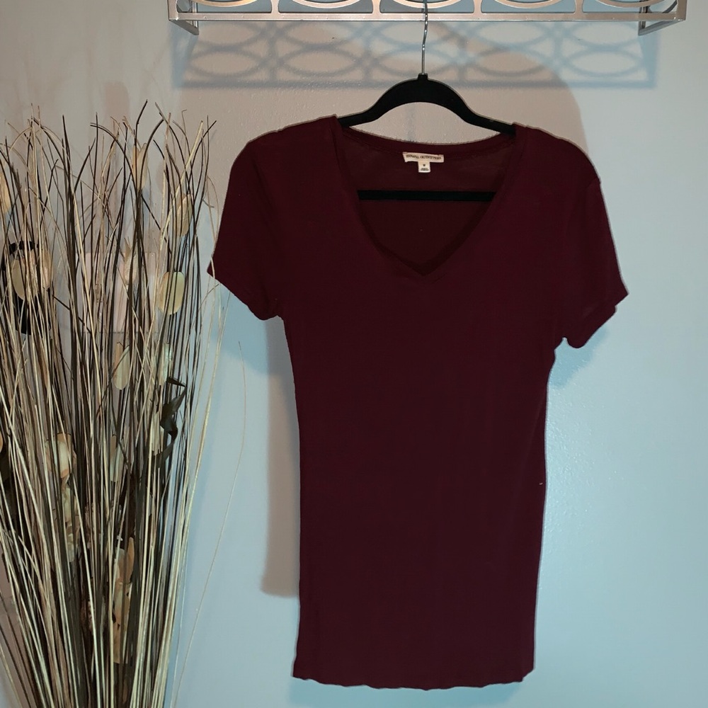 Maroon V-neck top.